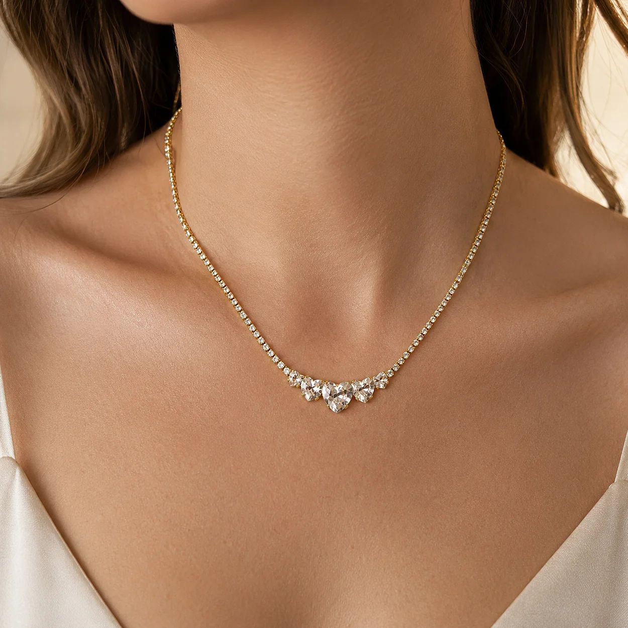 Women Necklaces with a gold-toned chain and clear stone cluster offer a refined look for bridal, evening, and gift collections.