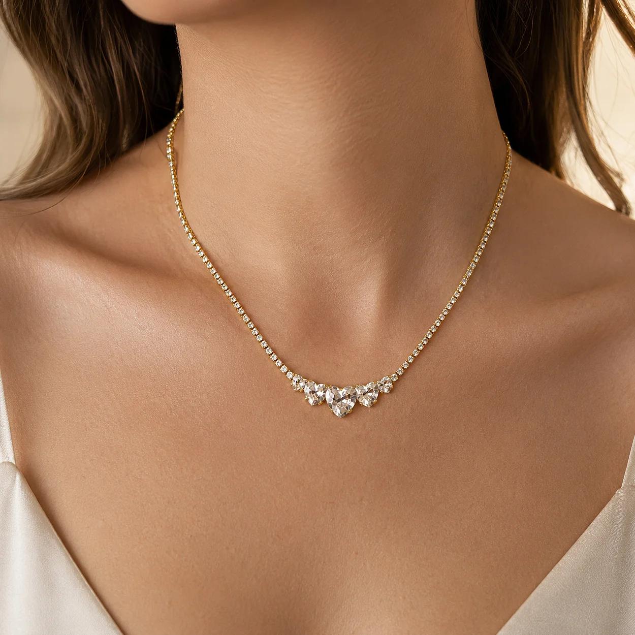 Women Necklaces with a gold-toned chain and clear stone cluster offer a refined look for bridal, evening, and gift collections.